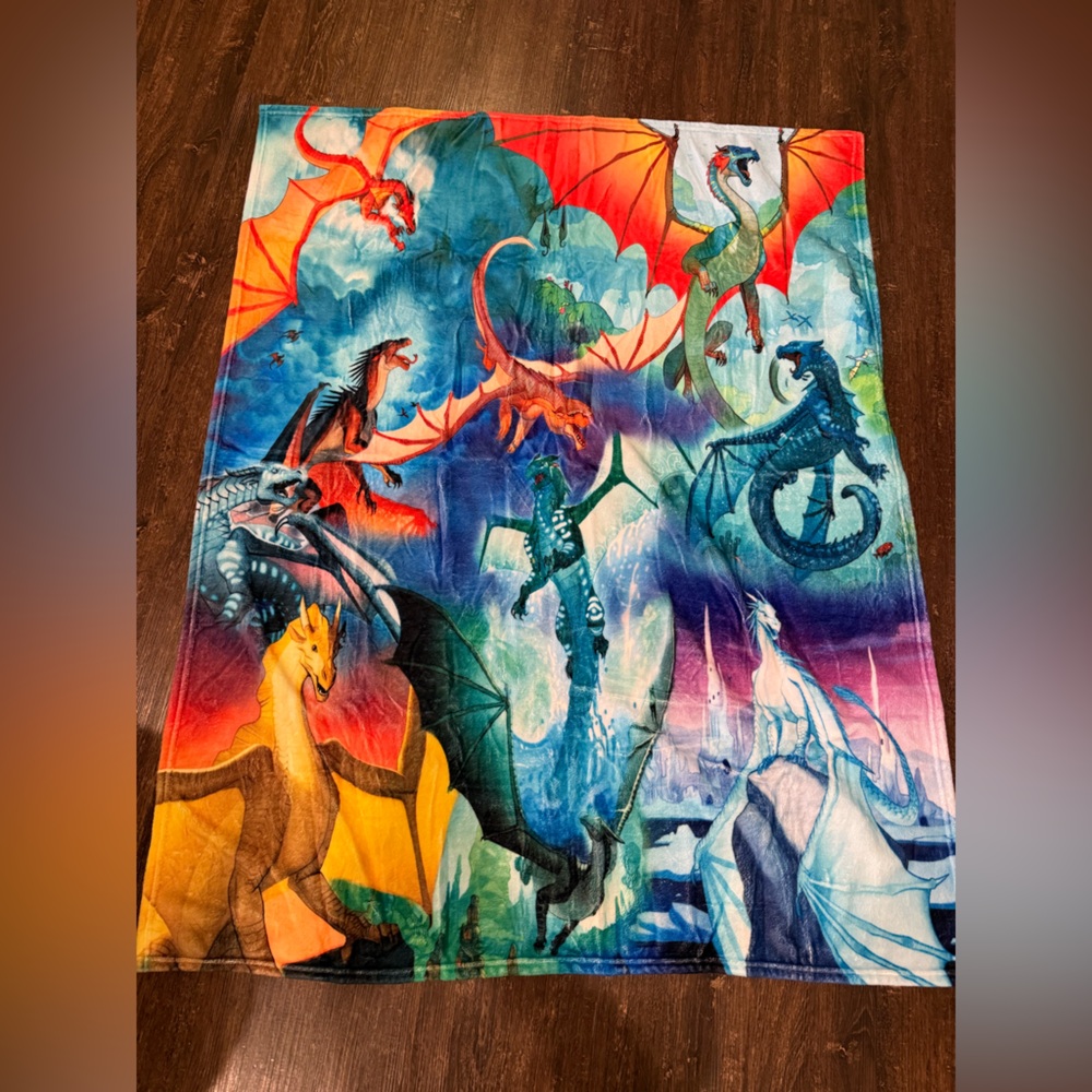 Colorful Wings of Fire Dragon fleece Blanket, 52 by 41 inches, like new.